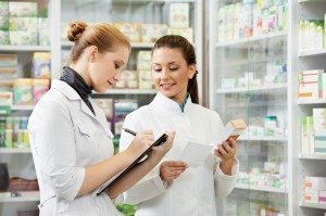 Pharmacy chemist women in drugstore